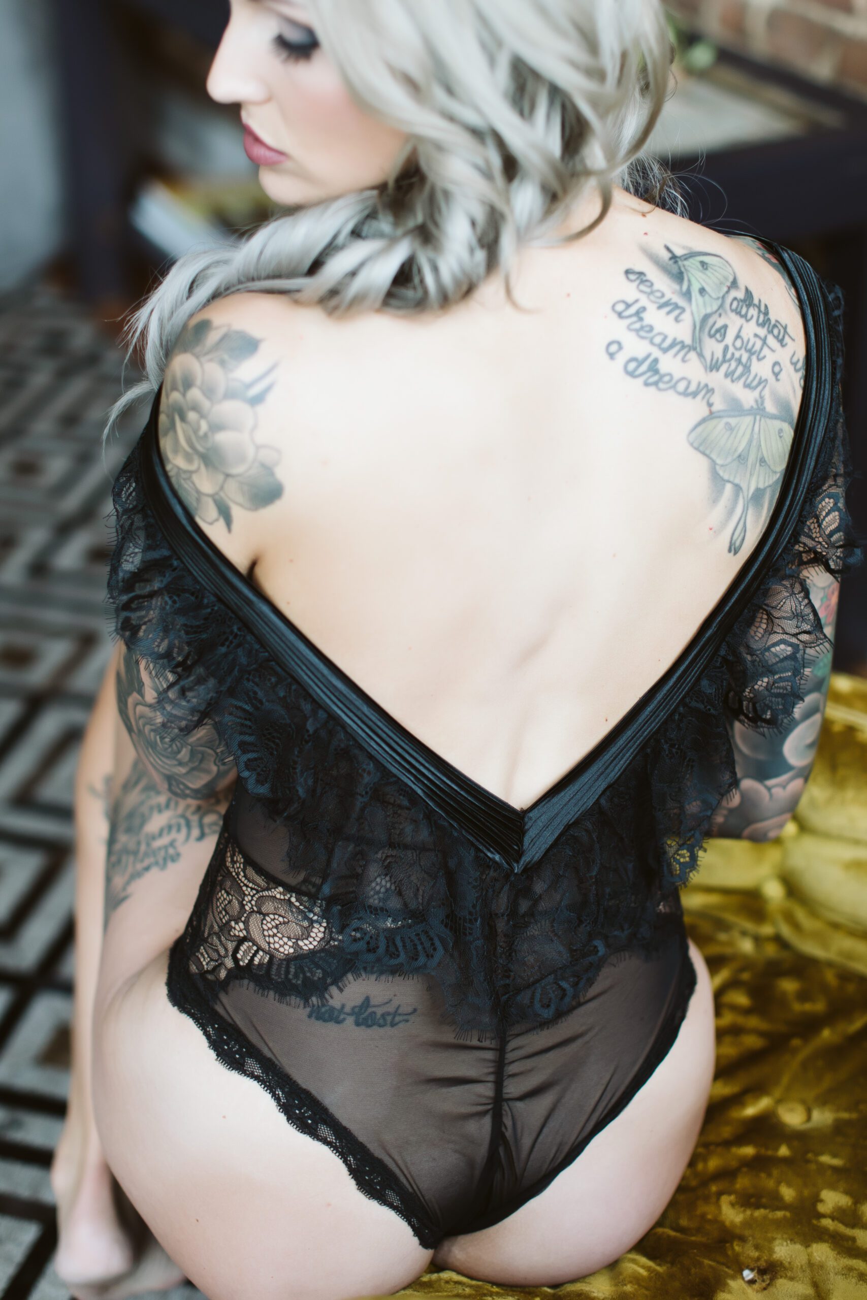 A stunning and empowering boudoir session featuring Amanda, captured in a beautifully lit setting by Jessica Yahn Photography in Springfield, MO.