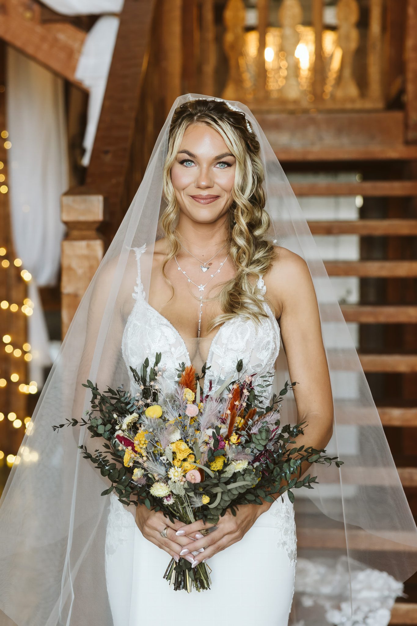 Skylar and Garrett celebrating their beautiful rustic wedding at Weathered Wisdom Barn in Preston, Missouri, captured by Jessica Yahn Photography.