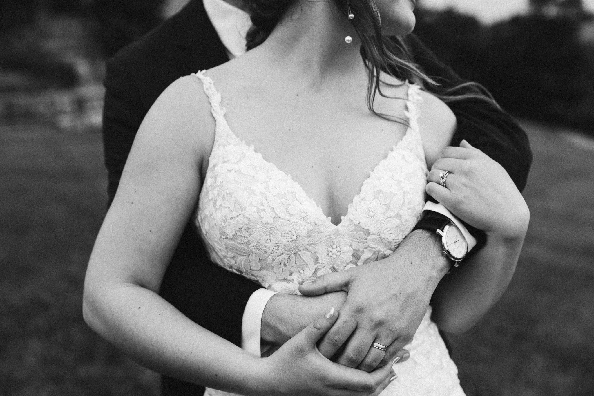 Courtney & Zane share a heartfelt moment on their wedding day at Integrity Hills in Branson, MO, surrounded by the natural beauty of Table Rock Lake and the Ozark mountains.